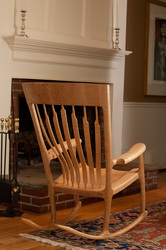 Curly Maple rocking chair in front of fireplace.
